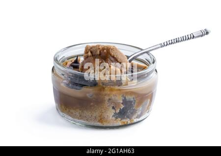 Mini  caramel cheesecake in a glass pot isolated on white Stock Photo