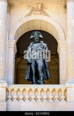 Close-up view of the statue of Napoleon Bonaparte on the balcony of the southern facade of the court of honor of the Hotel des Invalides in Paris. Stock Photo