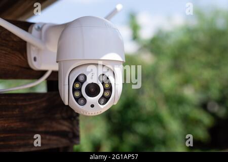 modern CCTV wifi surveillance camera in backyard Stock Photo