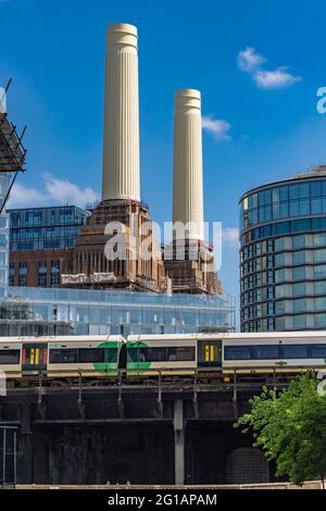 The tall distinctive chimneys of Battersea Power Station an iconic Grade II listed building undergoing extensive redevelopment , Nine Elms, London ,UK Stock Photo