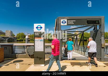 People at Battersea Power Station Pier ,a jetty on The River Thames   where Thames Clippers River Boat Services operate from , Battersea,London Stock Photo