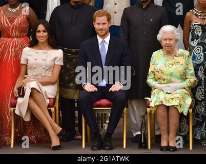File photo dated 26/6/2018 of Queen Elizabeth II with the Duke and Duchess of Sussex during a group photo at the Queen's Young Leaders Awards Ceremony at Buckingham Palace, London. The Duchess of Sussex gave birth to a 7lb 11oz daughter, Lilibet 'Lili' Diana Mountbatten-Windsor, on Friday in California and both mother and child are healthy and well, Meghan's press secretary said. Issue date: Sunday June 6, 2021. Stock Photo