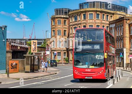 A red London double decker bus operating route156 to Wimbledon operated by Abellio Bus,making it's way along Queenstown Road in Battersea ,London, UK Stock Photo