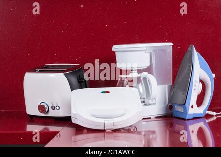 Kitchen Appliances Set. Red Blender, Toaster, Coffee Machine, Meat Ginder,  Food Mixer and Coffee Grinder on a wooden table. 3d Rendering Stock Photo -  Alamy