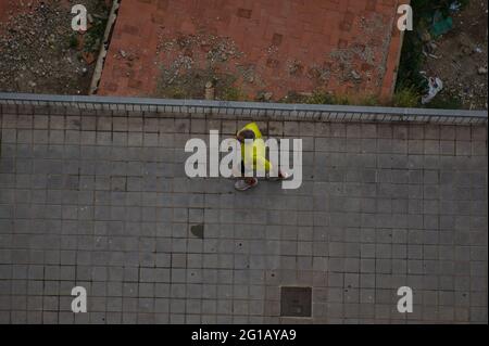 person doing exercises in the streets of the city of Alicante, in the Valencian Community, Spain. view Stock Photo
