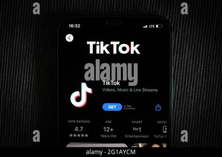TikTok app in the apple App Store seen on an iPhone 12 screen. Stock Photo