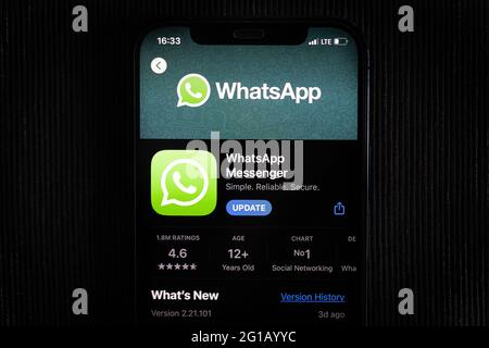 WhatsApp app in the apple App Store seen on an iPhone 12 screen. Stock Photo