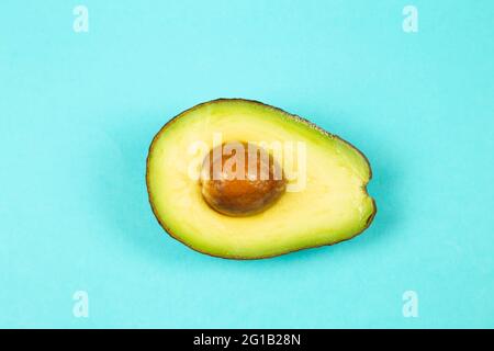Fresh avocado on blue background Stock Photo