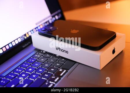 Tokyo, Japan. 06th June, 2021. In this photo illustration, Apple's iPhone 12 seen placed on a MacBook Pro. (Photo by Stanislav Kogiku/SOPA Images/Sipa USA) Credit: Sipa USA/Alamy Live News Stock Photo