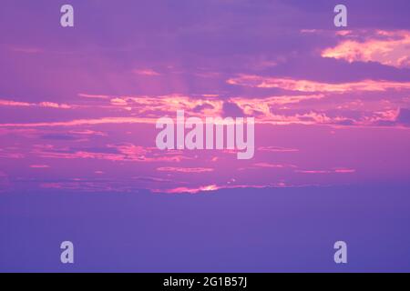Pop Art Style Lilac Colored Sun Rays Shining on the sky Stock Photo