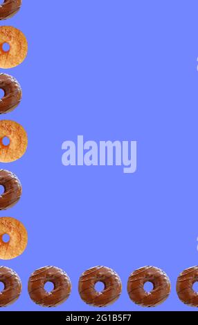 Frame of Chocolate Glazed Donuts and Sugar Cinnamon Donuts on Cornflower Blue Background Stock Photo