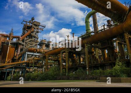 Steel factory and ironworks in the landscape park Duisburg Nord with closed blast furnace and ironworks as a panorama. Stock Photo