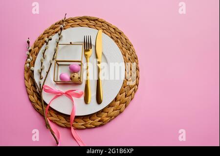 Blooming willow, easter egg on plate and tableware Stock Photo