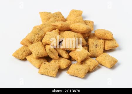 Heap of sweet dessert pillows isolated on white Stock Photo