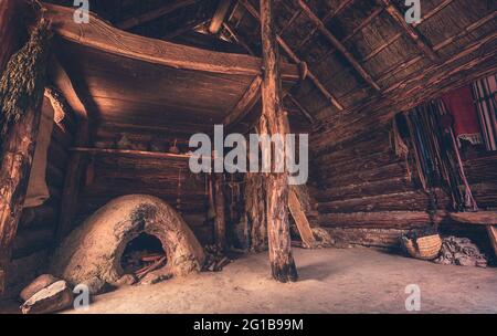 Old wooden hut and fisherman's hut. Close-up of an old hut in the Middle Ages. Old fisherman's hut and wooden hut with spices and pots. evil Dead. Stock Photo