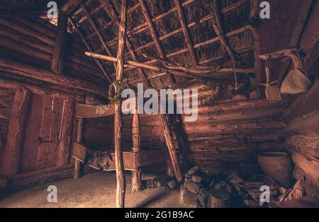 Old wooden hut and fisherman's hut. Close-up of an old hut in the Middle Ages. Old fisherman's hut and wooden hut with spices and pots. evil Dead. Stock Photo