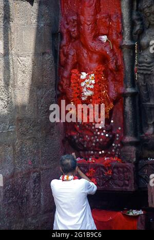 The outer walls of the Kamakhya temple are adorned with stone images depicting many deities such as the elephant headed God Ganesha. Guwahati, Assam, India. January 15, 2006. One of a set of photographs from the photo feature, Colour of the Deity – Kamakhya Temple, Assam, by Smita Barooah. Stock Photo