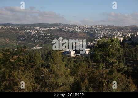 Biblical Judean Hills seen from the Jerusalem forest with Pine Trees,  Har Nof, Jerusalem neighborhood on the right, plus towns Motza & Mevaseret Zion Stock Photo