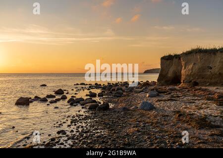 Evening light over the beach and cliffs in Klein Zicker, Mecklenburg-Western Pomerania, Germany Stock Photo