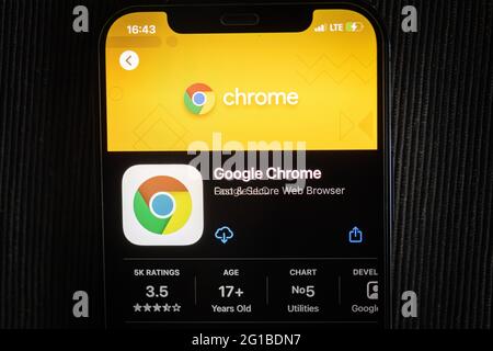 Google Chrome app in the apple App Store seen on an iPhone 12 screen. Stock Photo