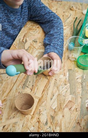 From above of crop anonymous kid making Help Me phrase with small ...