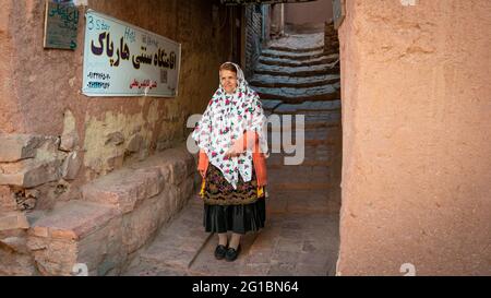 Abyaneh, Iran - May 2019: Woman with traditional Abyaneh Persian dress Stock Photo