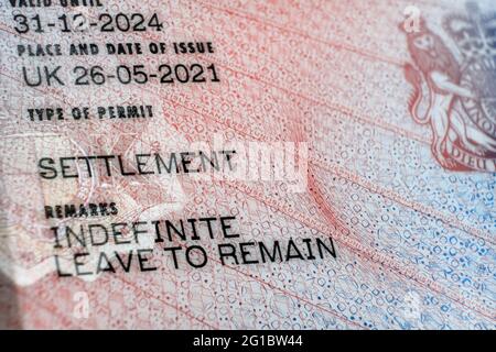 New type of biometric residence permit BRP card issued by Home Office in the UK in July 2021.  Close up of Residence Permit document for Indefinite Le Stock Photo