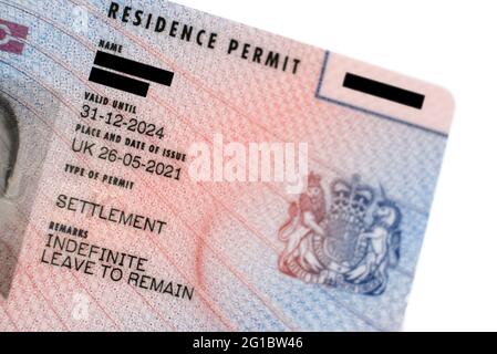 New type of biometric residence permit BRP card issued by Home Office in the UK in July 2021.  Close up of Residence Permit document for Indefinite Le Stock Photo