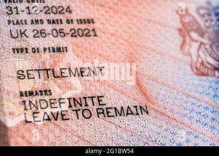 New type of biometric residence permit BRP card issued by Home Office in the UK in July 2021.  Close up of Residence Permit document for Indefinite Le Stock Photo