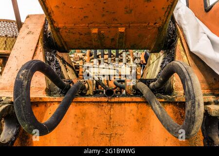 Hydraulic pressure pipes system of old abandoned construction machinery Stock Photo