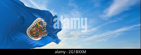Minsk, Belarus - May, 2021: Flag of Organization of American States waving in the wind at flagpole on background of blue sky. 3d illustration. Stock Photo