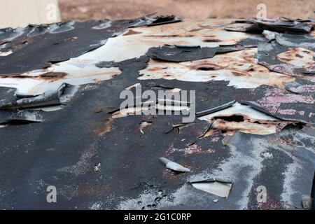 Close-up of peeled body paint from top of an old car. Selective focus points. Blurred background Stock Photo