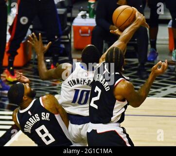 Los Angeles, United States. 06th June, 2021. Los Angeles Clippers forward Kawhi Leonard (2) blocks the shot by Dallas Mavericks forward Dorian Finney-Smith (10) during the second half of Game 7 of their first-round playoff matchup at Staples Center in Los Angeles on June 6, 2021. The Clippers defeated the Mavericks 126-111. They advance to face the top-seeded Jazz starting Tuesday in Utah. Photo by Jim Ruymen/UPI Credit: UPI/Alamy Live News Stock Photo