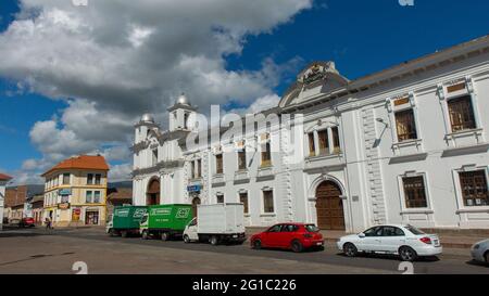 Latacunga, Cotopaxi / Ecuador - June 5 2021: People walking near the church of San Agustin in the center of the city of Latacunga on a sunny day Stock Photo