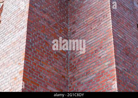 Fragment red brick wall catholic church nice background. Stock Photo