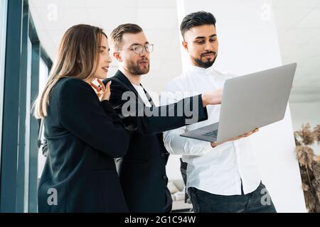 Group of young business people in the office use laptop Stock Photo
