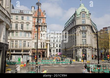 London, UK - April 21, 2021: Slightly elevated view of roadworks at the junction of The Strand and Lancaster Place in central London on a sunny mornin Stock Photo