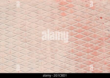 Pale pink concrete in a diamond pattern. Background.  Stock Photo