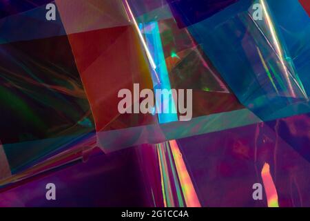 Holographic abstract multicolored background. Vibrant colors, futuristic retro style. Stock Photo