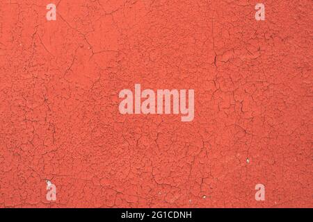 Dyed And Cracked Flaked Texture Of Red Paint At Wall Surface Stock Photo