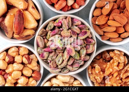 Nuts assortment close-up shot. Pistachios and Brazil nuts, almonds and hazelnuts, walnuts Stock Photo