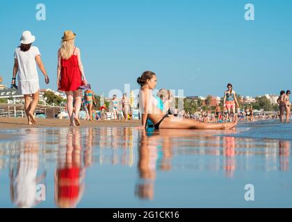 Antalya, Turkey-September 7, 2017: Beach-goers sunbathing, swimming or doing other activites on the beach in summer in Antalya. Stock Photo