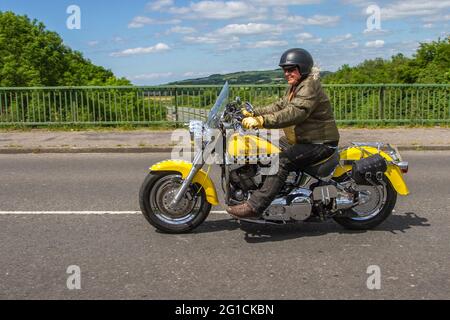 2006 yellow Harley Davidson Flstf Fatboy Fuel injected 1450cc cruiser motorcycle, Motorbike rider; two wheeled transport, motorcycles, vehicle, roads, motorbikes, motorcycle bike riders motoring in Chorley, Stock Photo