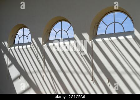 Windows and long shadows in the Orangery, Wrest Park, Silsoe, Bedfordshire, UK Stock Photo