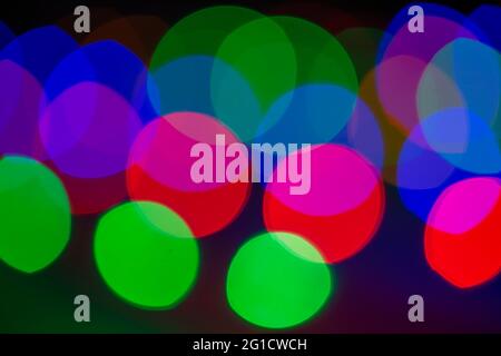 blurred bokeh light background , glare and glowing lights in night city, modern beautiful bright background Stock Photo