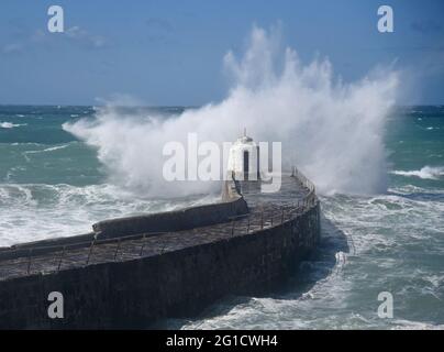 Sea Storm off the Coast of Cornwall and batters  monkey hut at Portreath. Stock Photo