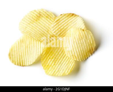 Heap of ridged potato chips isolated on white background, top view Stock Photo