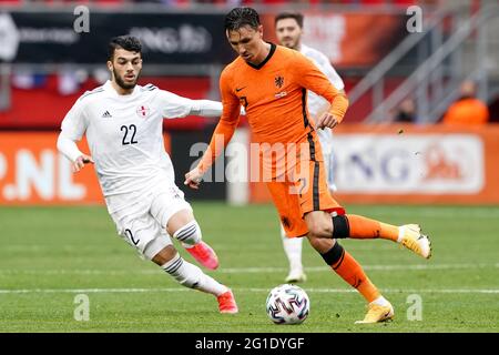 ENSCHEDE, NETHERLANDS - JUNE 6: Georges Mikautadze of Georgia and Steven Berghuis of the Netherlands during the International Friendly match between N Stock Photo