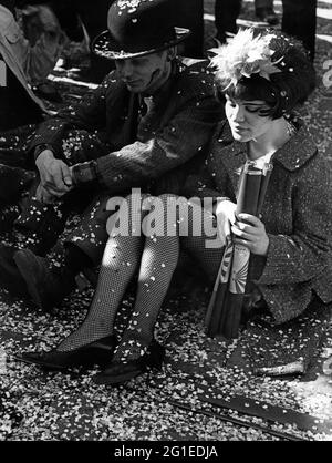 festivities, carnival, masked couple is sitting on the pavement, Germany, 1960s, ADDITIONAL-RIGHTS-CLEARANCE-INFO-NOT-AVAILABLE Stock Photo