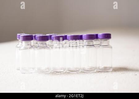 Empty glass jars of coronavirus vaccines. No people Stock Photo